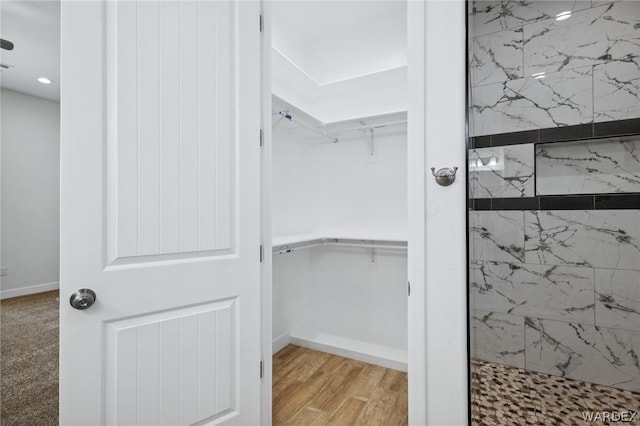 walk in closet featuring light wood-type flooring