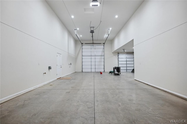 garage with baseboards and recessed lighting