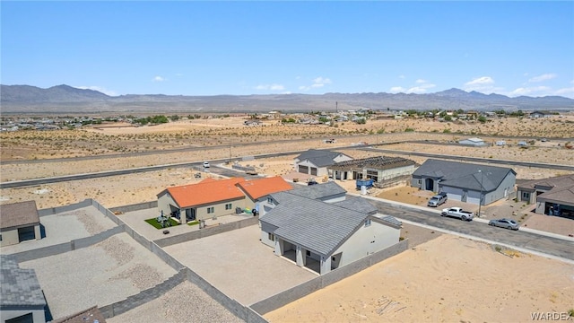 drone / aerial view featuring a residential view and a mountain view