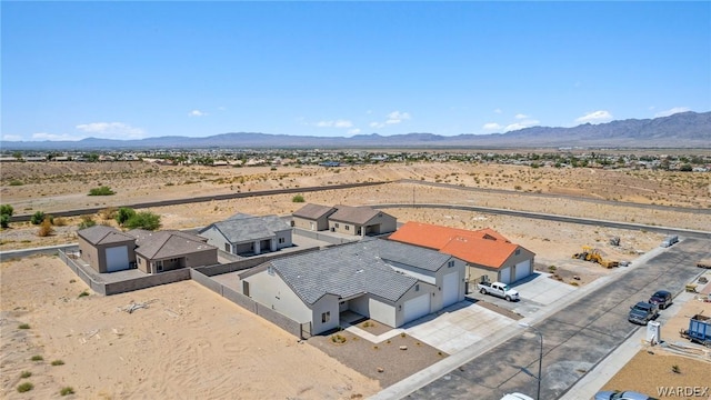 bird's eye view with view of desert and a mountain view