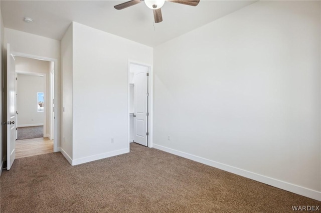 unfurnished bedroom with a ceiling fan, baseboards, and carpet flooring