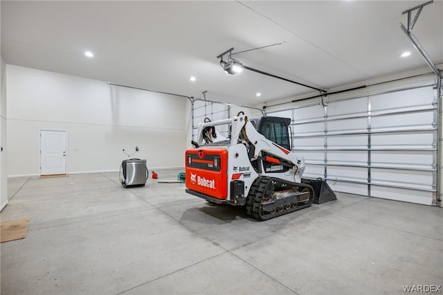 garage with baseboards and a garage door opener