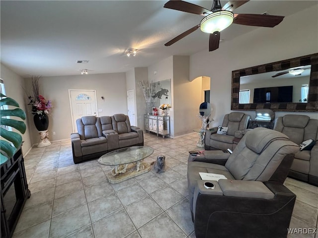 1481 E Topaz Cir Unit 2, Fort Mohave, AZ 86426 - living area featuring light tile patterned floors, visible vents, ceiling fan, and arched walkways