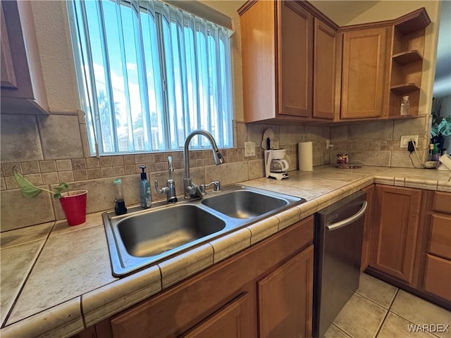 1481 E Topaz Cir Unit 2, Fort Mohave, AZ 86426 - kitchen with a sink, open shelves, brown cabinetry, stainless steel dishwasher, and tasteful backsplash