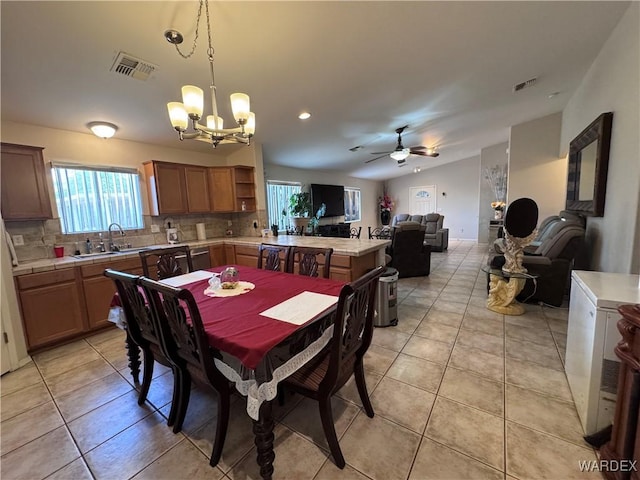 1481 E Topaz Cir Unit 2, Fort Mohave, AZ 86426 - dining space with a wealth of natural light, ceiling fan with notable chandelier, and visible vents