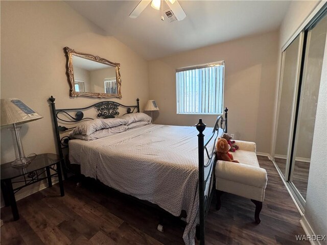 1481 E Topaz Cir Unit 2, Fort Mohave, AZ 86426 - bedroom with a closet, visible vents, dark wood-style floors, and vaulted ceiling