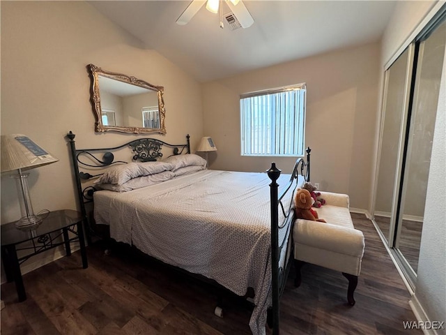 1481 E Topaz Cir Unit 2, Fort Mohave, AZ 86426 - bedroom featuring vaulted ceiling, a closet, dark wood-type flooring, and visible vents