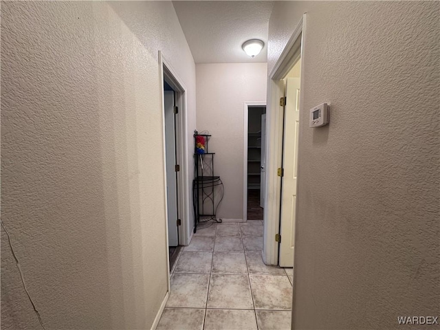 1481 E Topaz Cir Unit 2, Fort Mohave, AZ 86426 - hallway featuring a textured wall and light tile patterned floors