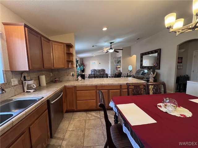 1481 E Topaz Cir Unit 2, Fort Mohave, AZ 86426 - kitchen with a peninsula, tasteful backsplash, ceiling fan, open floor plan, and stainless steel dishwasher