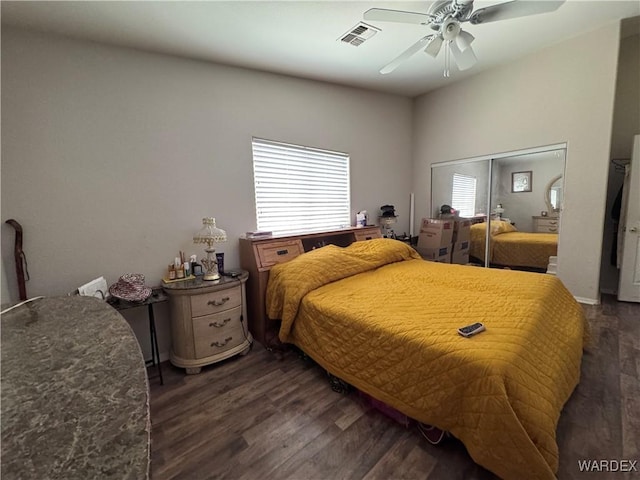 1481 E Topaz Cir Unit 2, Fort Mohave, AZ 86426 - bedroom with a ceiling fan, a closet, visible vents, and dark wood-type flooring