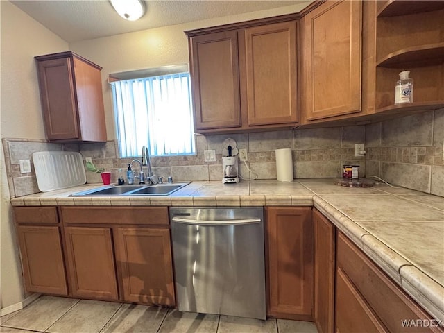 1481 E Topaz Cir Unit 2, Fort Mohave, AZ 86426 - kitchen with backsplash, tile countertops, a sink, and dishwasher