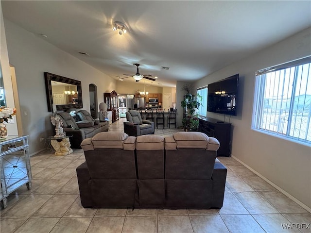 1481 E Topaz Cir Unit 2, Fort Mohave, AZ 86426 - living room with lofted ceiling, arched walkways, a ceiling fan, and light tile patterned floors