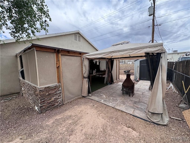 1481 E Topaz Cir Unit 2, Fort Mohave, AZ 86426 - exterior space featuring a storage shed, a patio, fence, an outdoor structure, and a gazebo