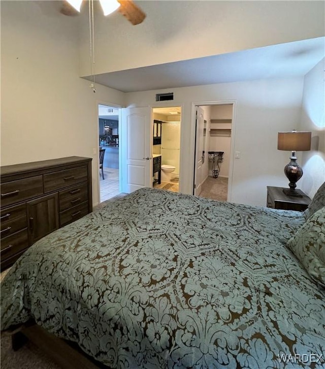 bedroom with ensuite bath and visible vents