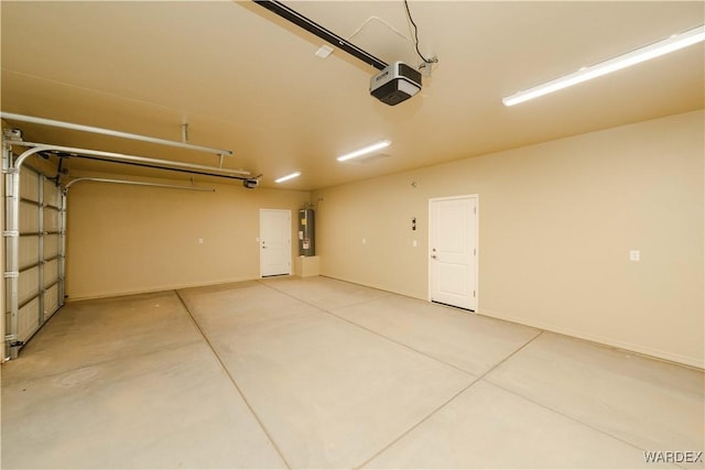 garage with electric water heater and a garage door opener