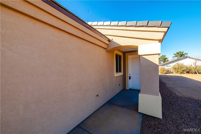 exterior space featuring stucco siding