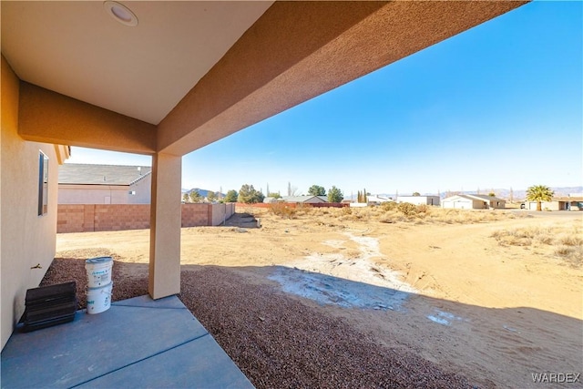 view of yard featuring a patio area and fence