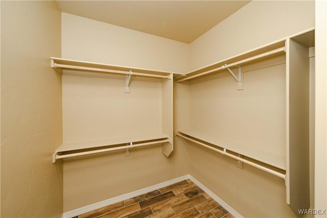 spacious closet featuring wood tiled floor