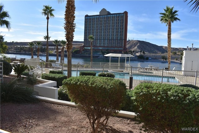 property view of water with fence and a mountain view