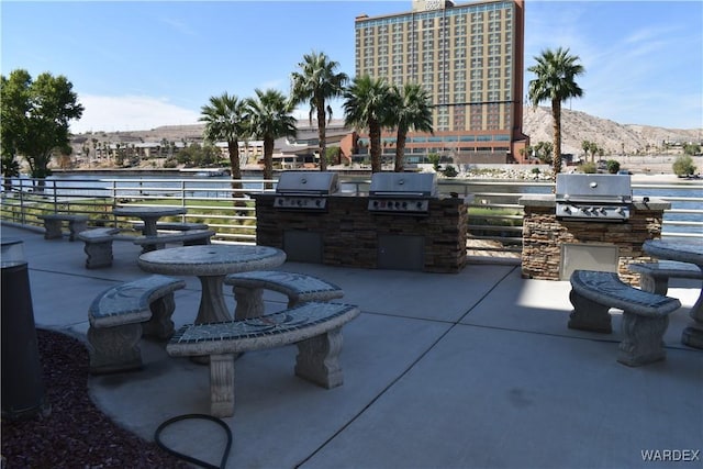 view of patio / terrace with a mountain view and area for grilling