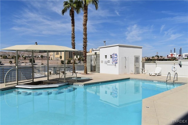 pool featuring a gazebo and fence