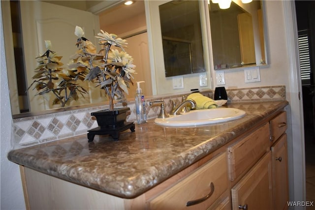 bathroom featuring backsplash and vanity