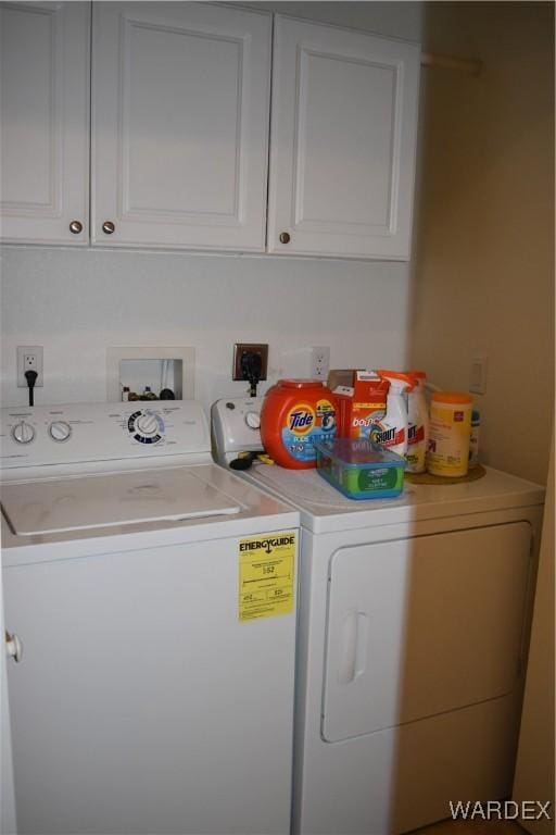 laundry area with cabinet space and washing machine and clothes dryer