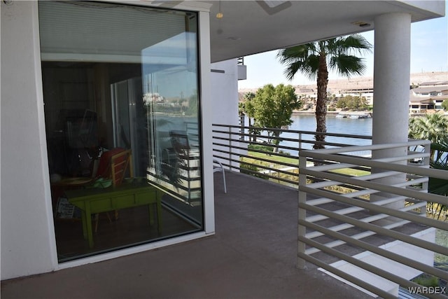 balcony featuring a water view