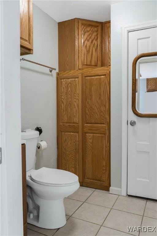 bathroom featuring toilet and tile patterned floors