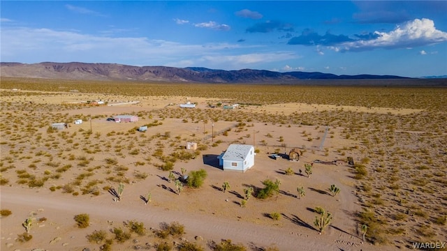 bird's eye view with a mountain view and view of desert