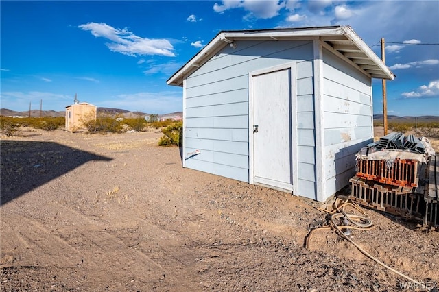 view of shed with a mountain view