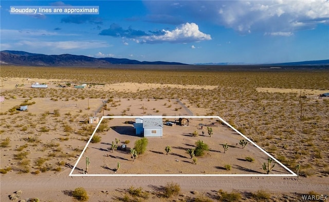 aerial view featuring view of desert and a mountain view