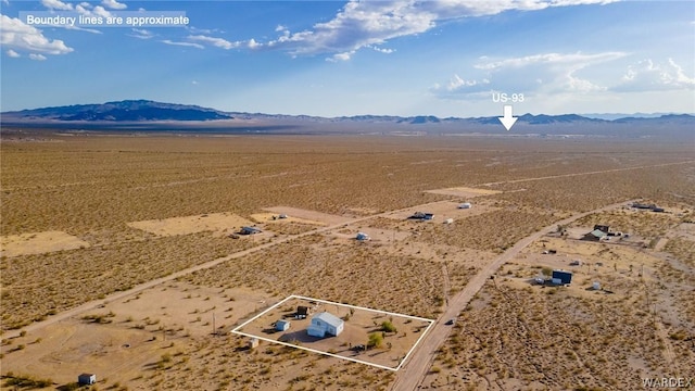 birds eye view of property featuring view of desert and a mountain view