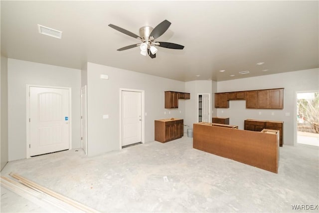 living room with visible vents and ceiling fan