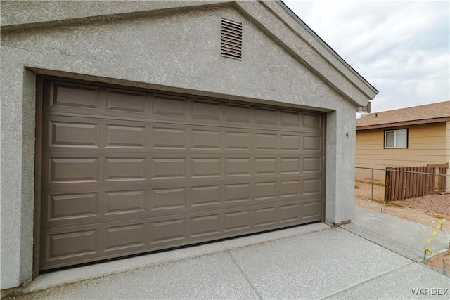 garage featuring fence