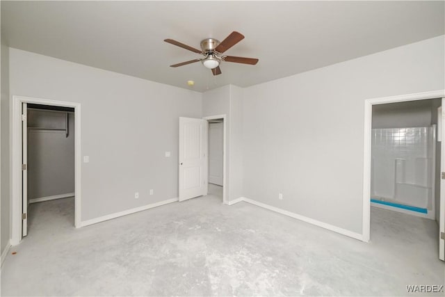 unfurnished bedroom featuring baseboards, a ceiling fan, unfinished concrete flooring, a walk in closet, and a closet