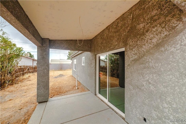 view of patio featuring fence