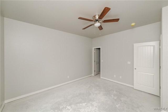 unfurnished room featuring unfinished concrete flooring, baseboards, and ceiling fan