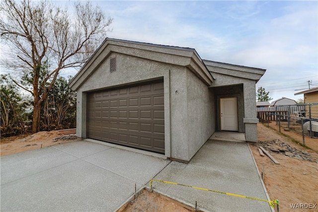 garage featuring fence