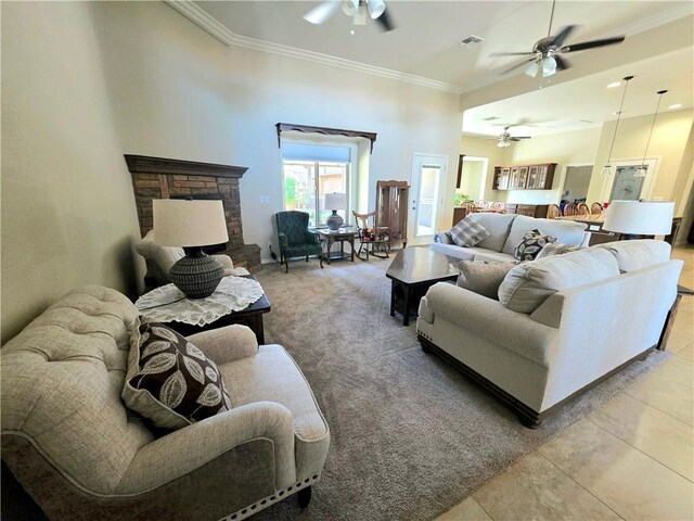 4132 Monte Silvano Ct, Kingman, AZ 86401 - living area featuring ceiling fan, crown molding, a fireplace, and carpet