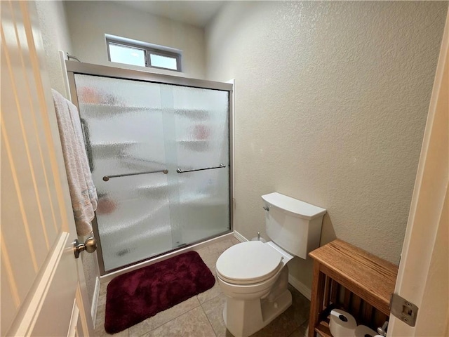 4132 Monte Silvano Ct, Kingman, AZ 86401 - bathroom with a shower stall, a textured wall, and tile patterned flooring