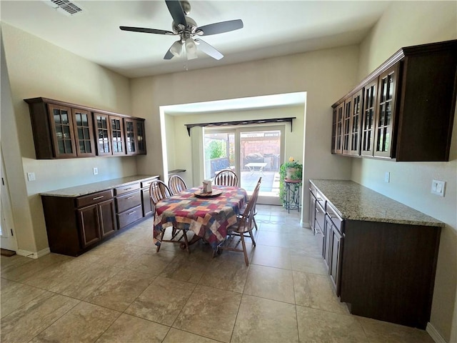 4132 Monte Silvano Ct, Kingman, AZ 86401 - dining space with ceiling fan and light tile patterned floors