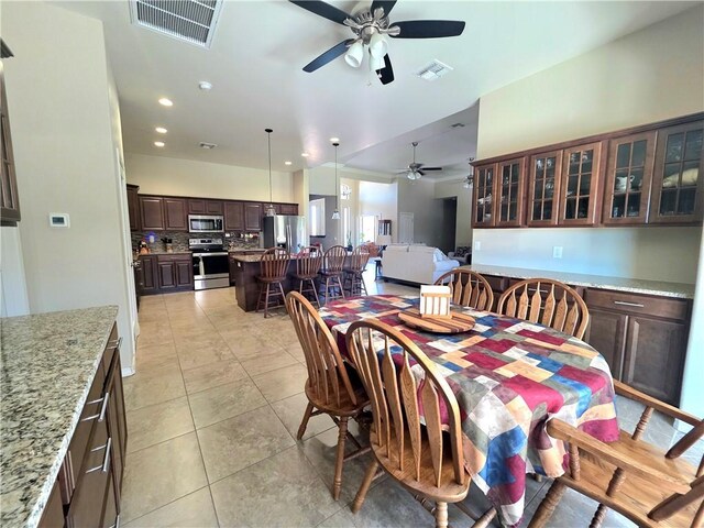 4132 Monte Silvano Ct, Kingman, AZ 86401 - dining room featuring a ceiling fan, light tile patterned floors, and recessed lighting