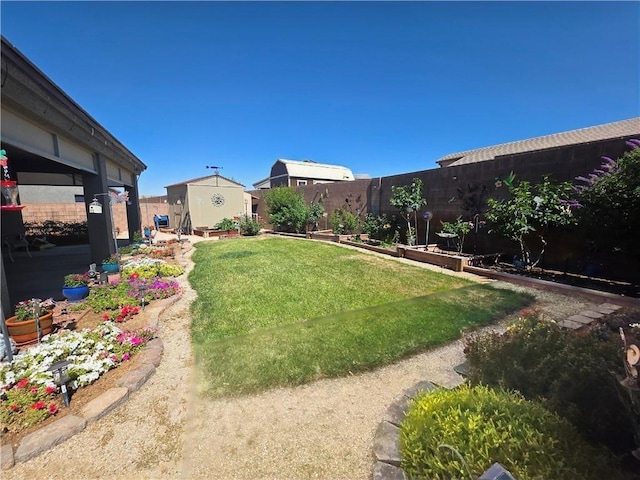 4132 Monte Silvano Ct, Kingman, AZ 86401 - fenced backyard with a storage unit and a vegetable garden
