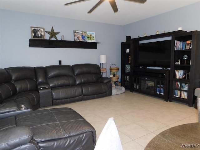 living room with a ceiling fan and light tile patterned floors