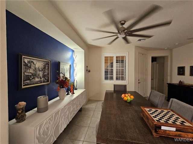 dining area featuring light tile patterned floors, ceiling fan, and visible vents