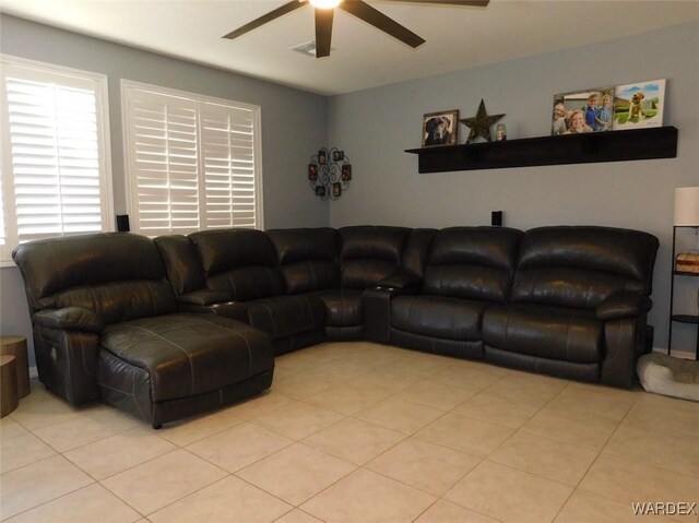 living room featuring light tile patterned flooring and a ceiling fan