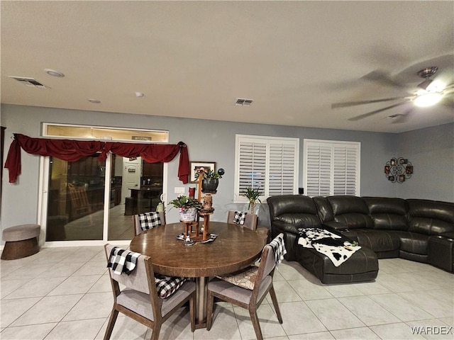 dining room featuring light tile patterned floors, ceiling fan, and visible vents