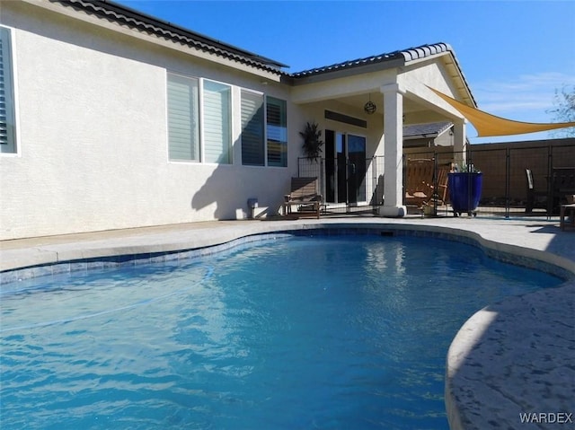 view of pool featuring a fenced in pool, fence, and a patio