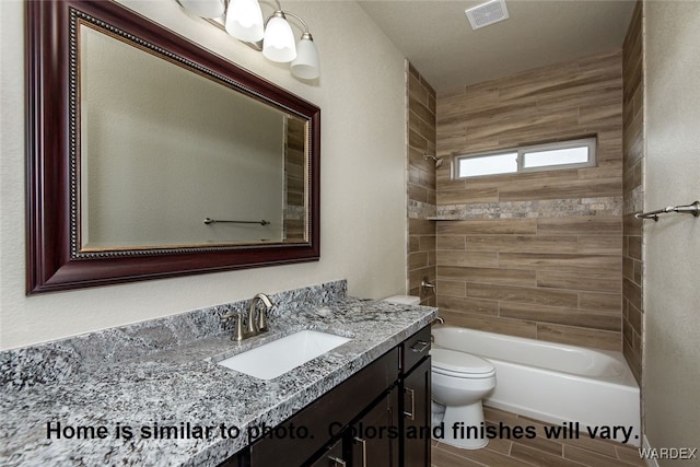 full bath with toilet, wood finished floors, visible vents, vanity, and  shower combination